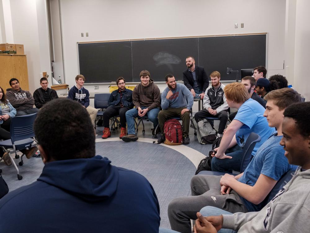 Students sitting in a circle in a classroom