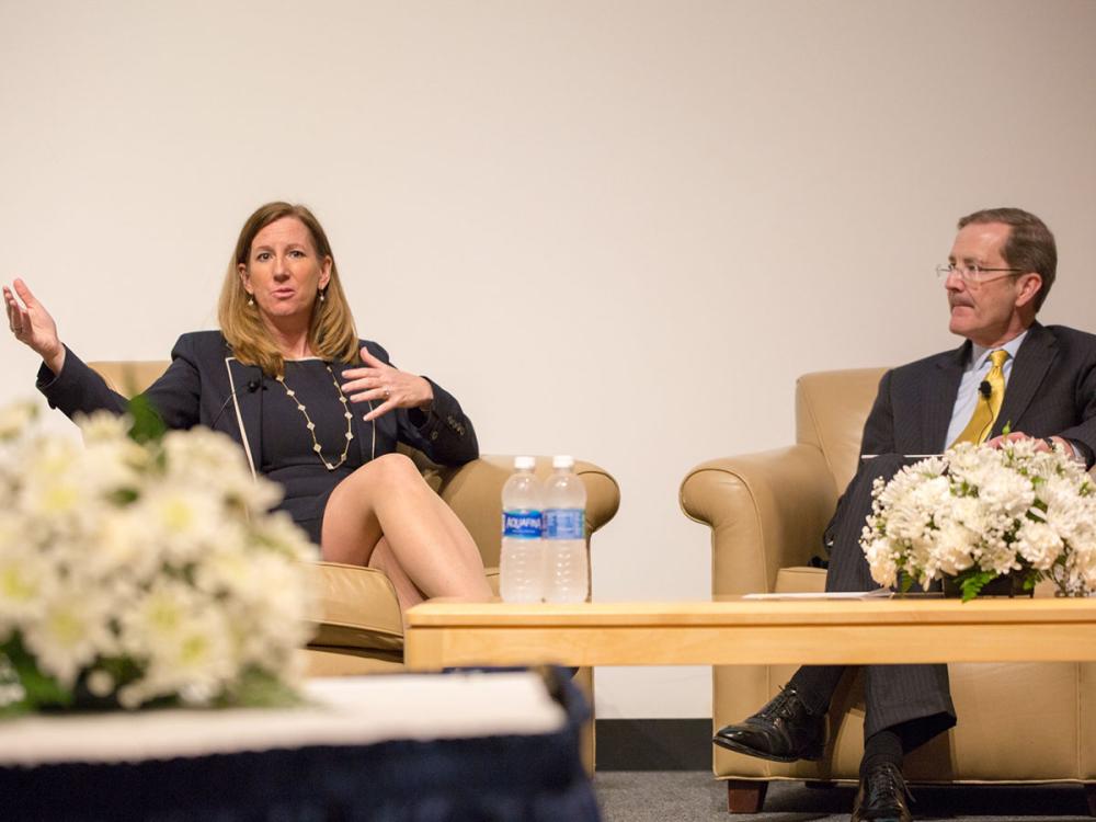 A photo of Cathy Engelbert, then-CEO of Deloitte, sits with Charles H. Whiteman, dean of the Smeal College of Business