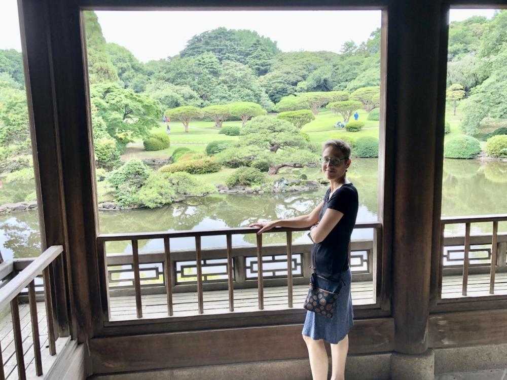 Photo of Jessamyn Abel standing in a garden in Japan 