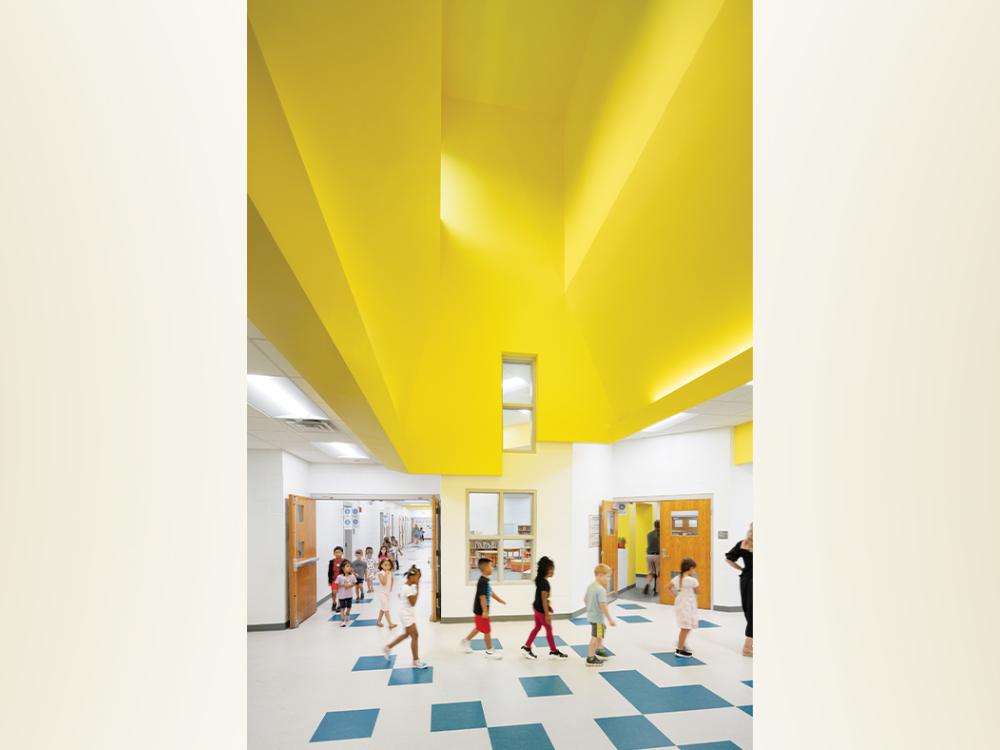 An architectural rendering of a school setting with a bright yellow ceiling. 