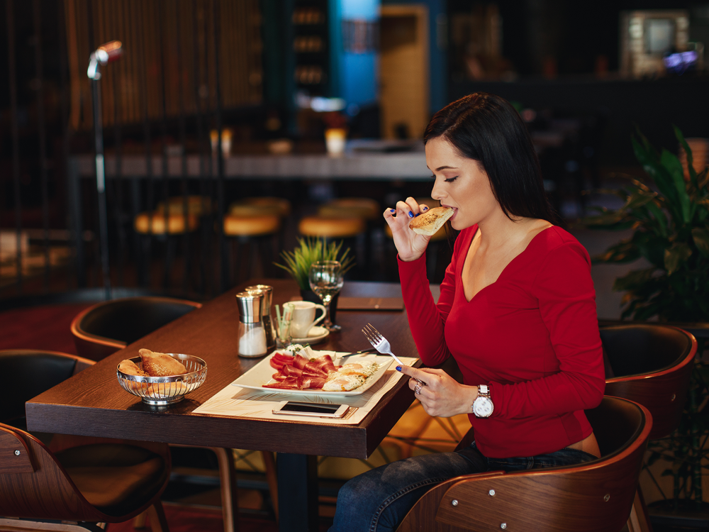 Person eating in a restaurant