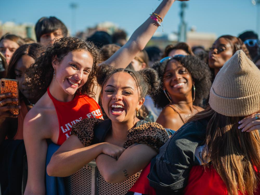 People singing at a concert. 