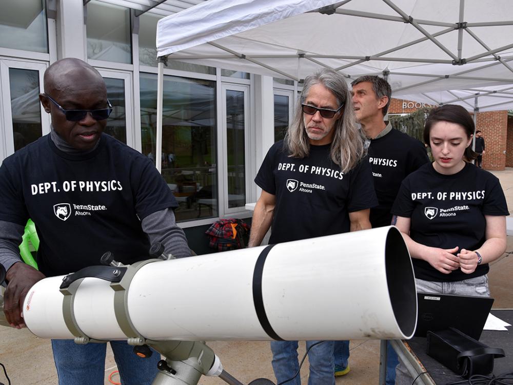 Members of Altoona physics department prep telescope 