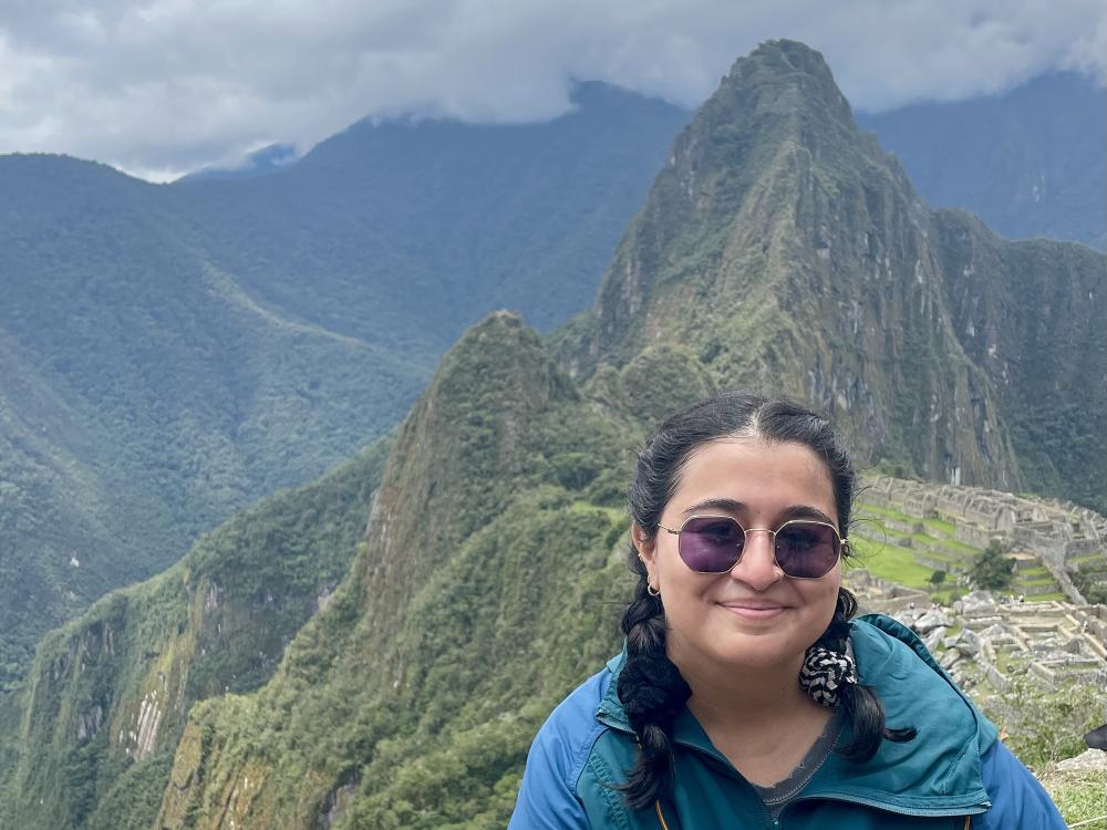 Amanda Mohamed at Machu Picchu with Huayna Picchu in the background