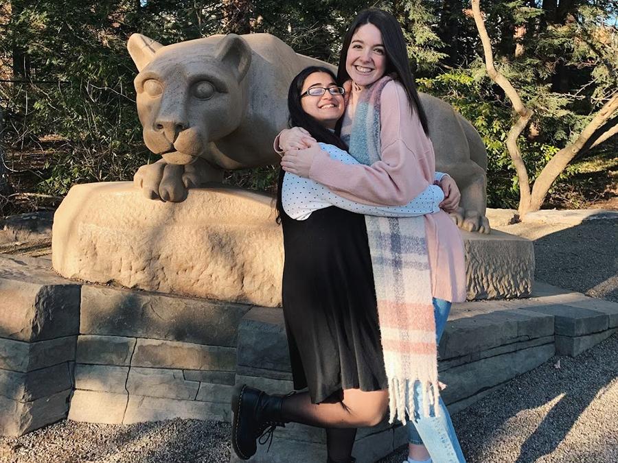 Amanda Mohamed poses with her best friend, Meghan Caswell, at the Nittany Lion Shrine.