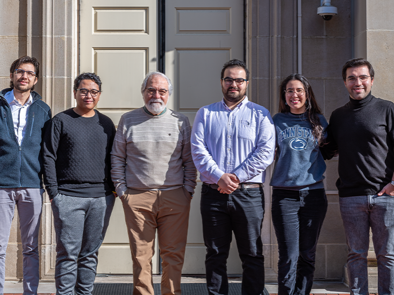 Nicolas Bueno, Hanif Yoga, Turgay Ertekin, Nijat Gasimli, Ianna Gomez and Baran Yucel standing in front of Hosler Building