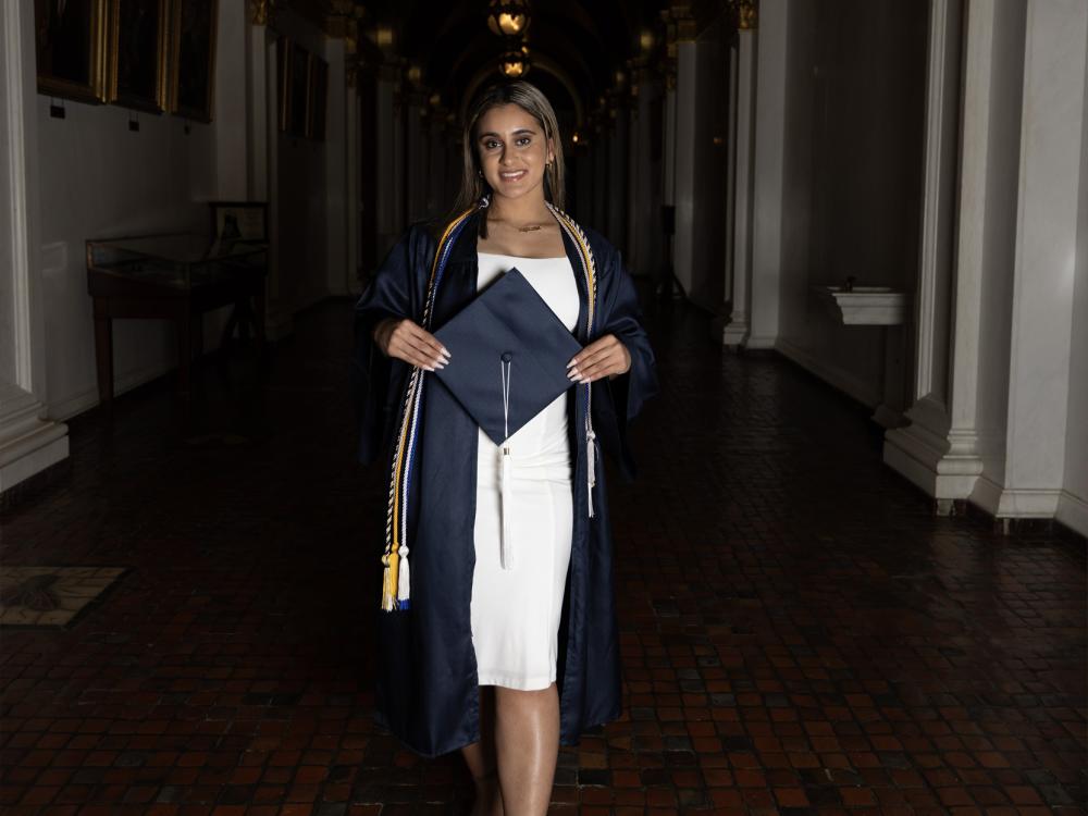 Gurleen Grewal poses at the state Capitol with her cap and gown