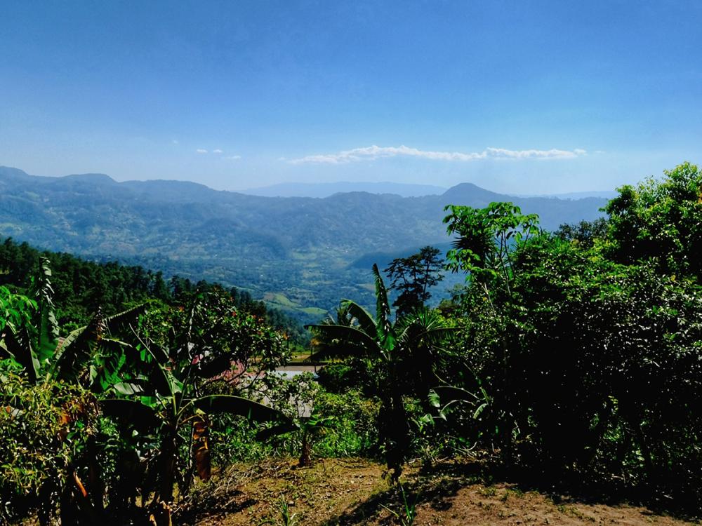 A photo of blue sky above mountains in Honduras.