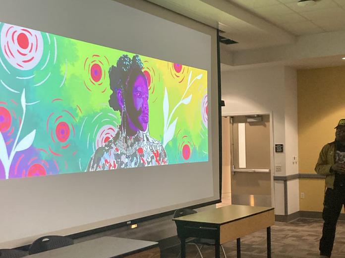 Projector screen with image of vibrant mural with profile of a Black person