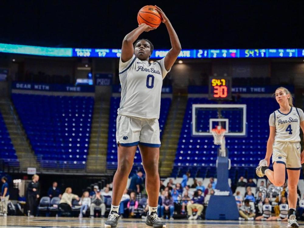 Owusu shooting basketball