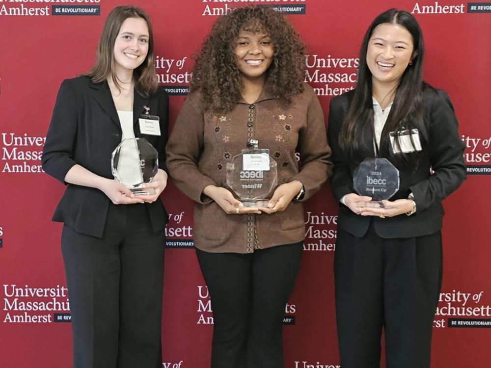 A photo of three female Smeal students holding trophies