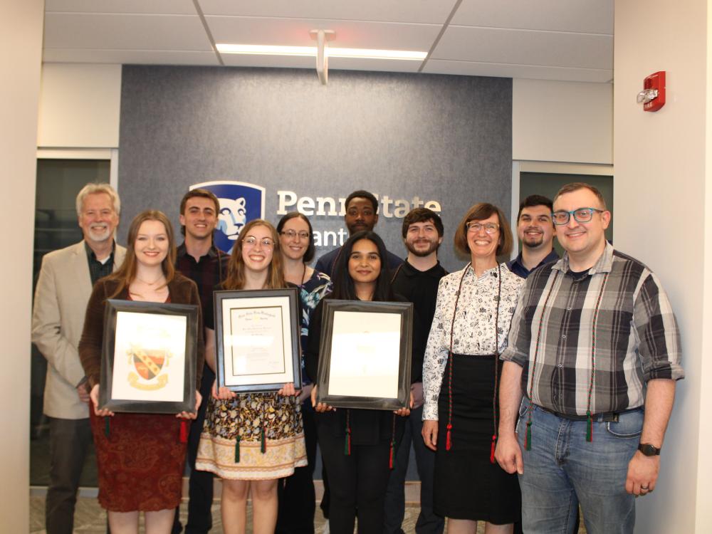 group of honor society inductees pose for a photo