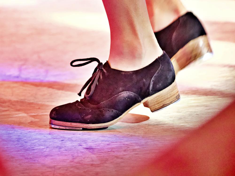 a close up of tap shoes dancing
