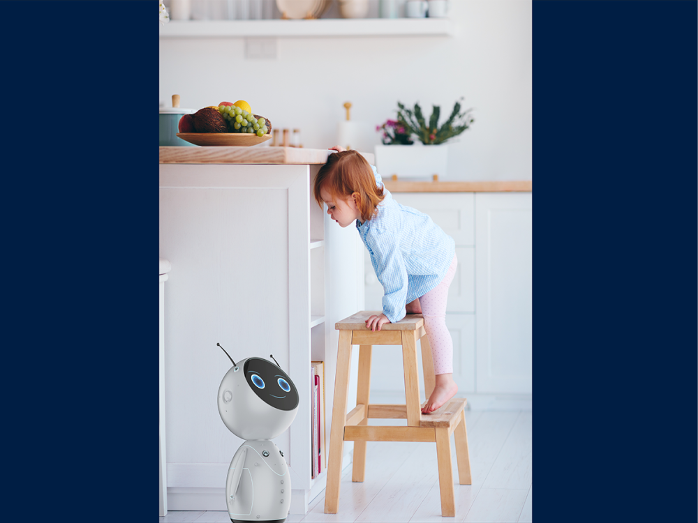 A child in a kitchen looking down at a robot