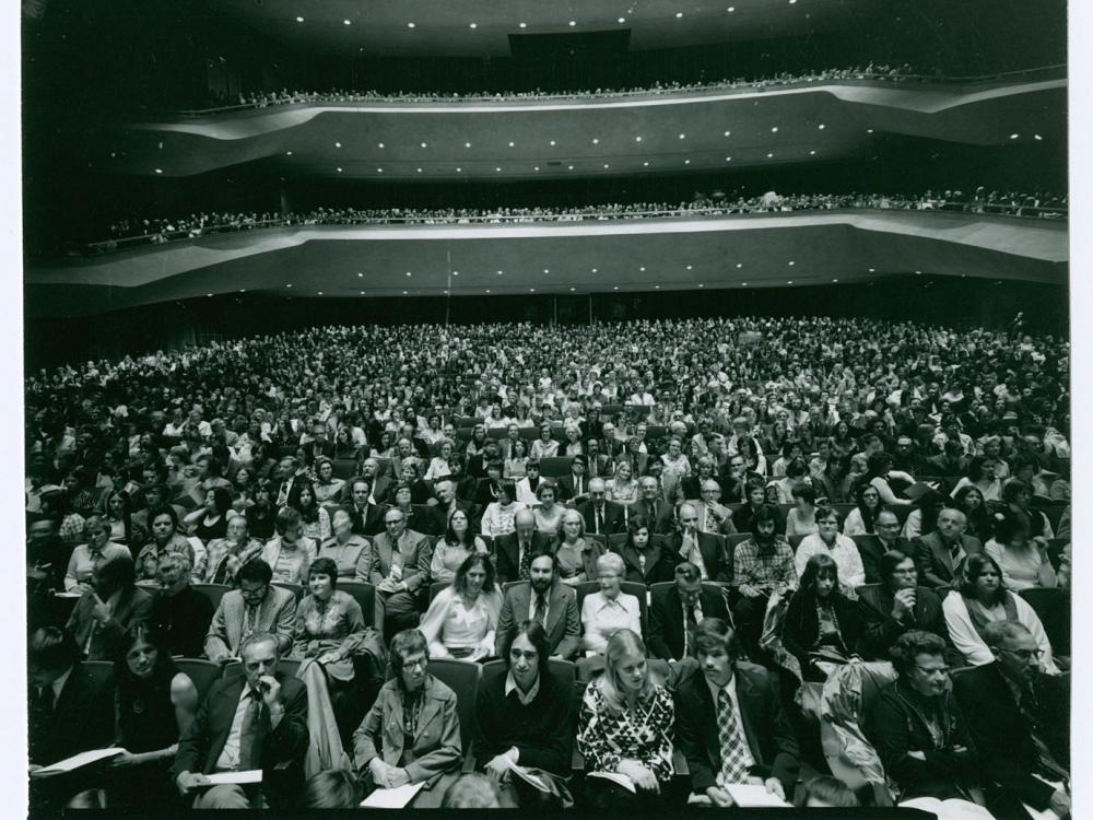 A large audience in an auditorium