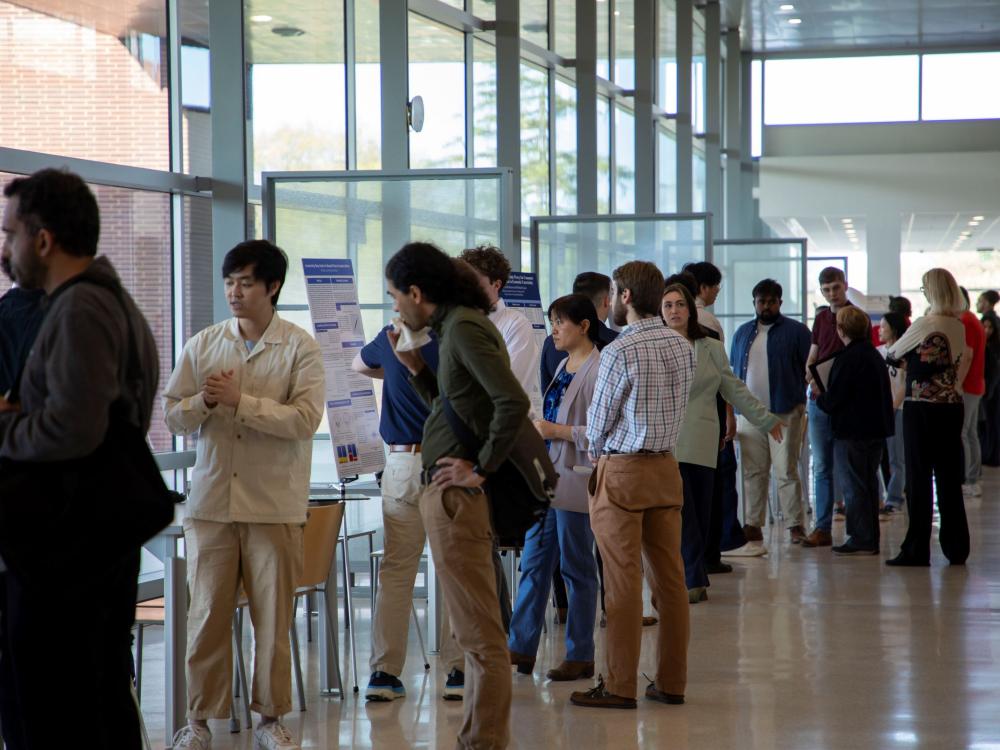 group of people observing projects in campus building