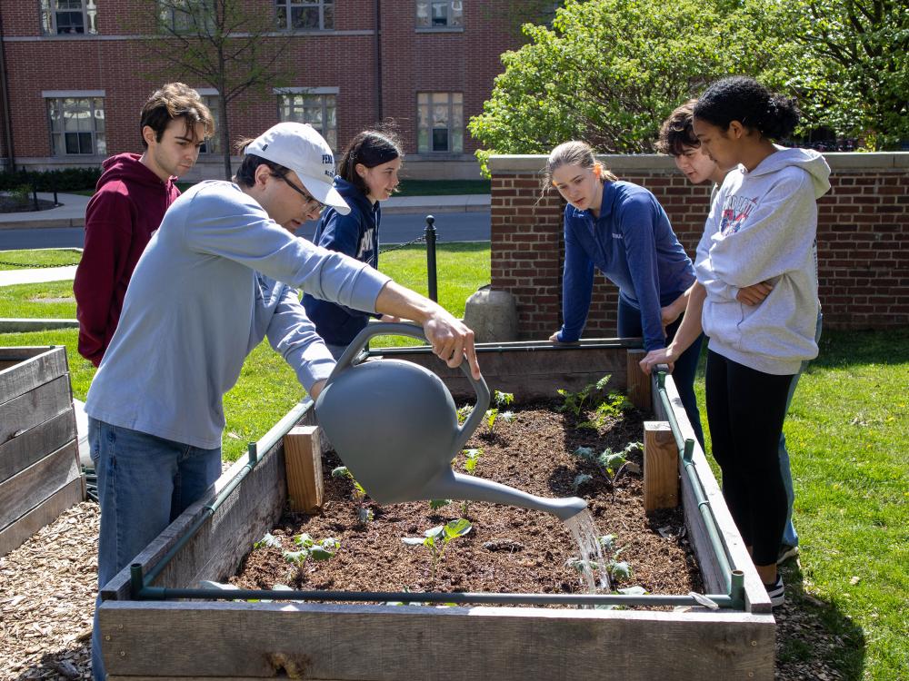 schreyer pocket garden volunteers tending to a garden bed