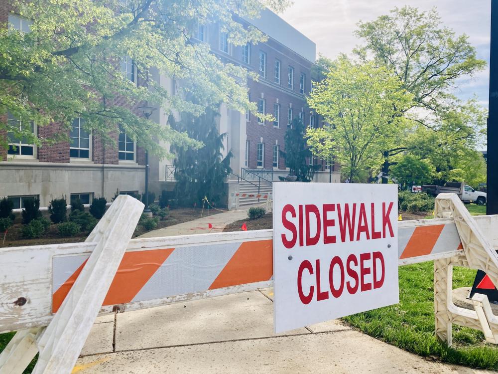A sign that states "sidewalk closed" 