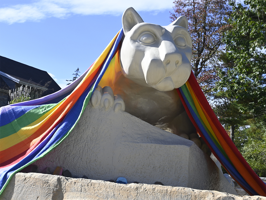 A pride flag draped over the Nittany Lion shrine at Penn State Wilkes-Barre.