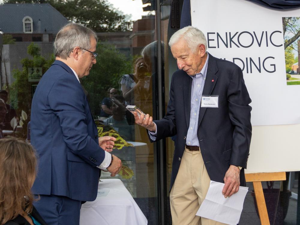 Stephen Benkovic being presented an etching of the Benkovic Building Naming Ceremony