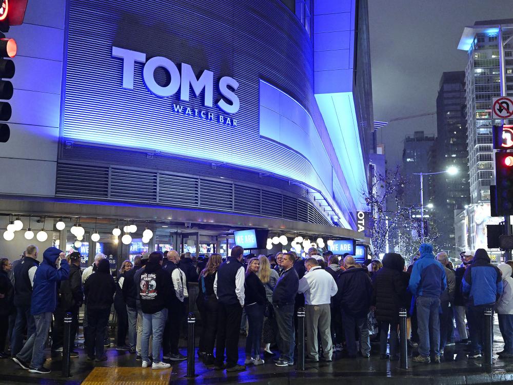 Penn Staters standing outside building