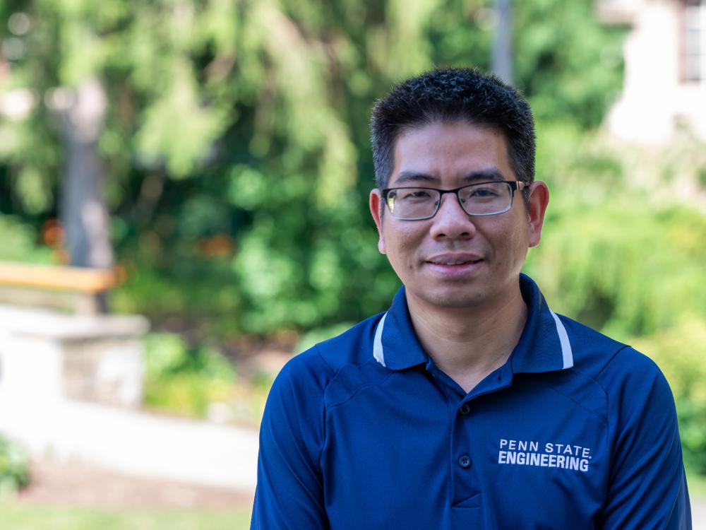 A portrait of a person in glasses and a blue polo that says "Penn State Engineering"