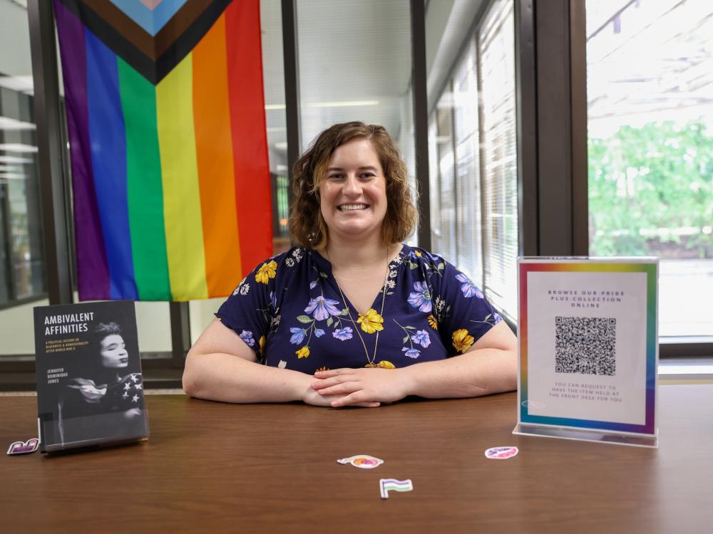 Jane Homan with pride collection at Brandywine library