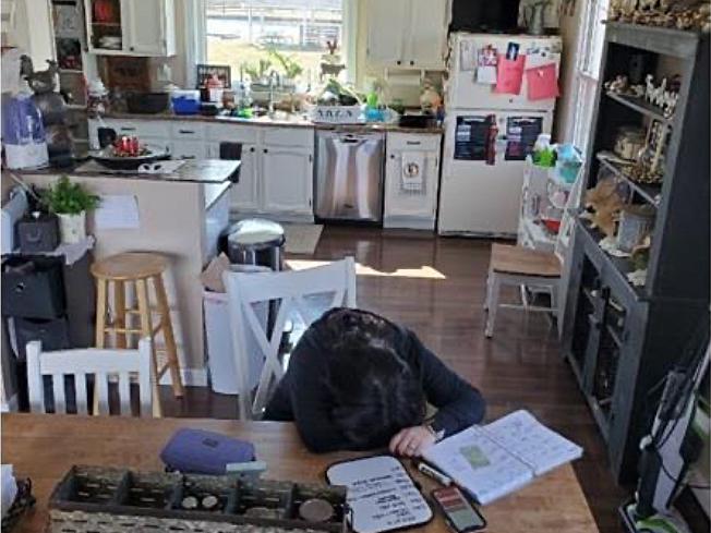 Person asleep at a table