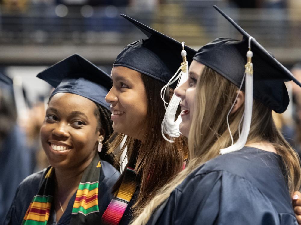 graduates sing alma mater