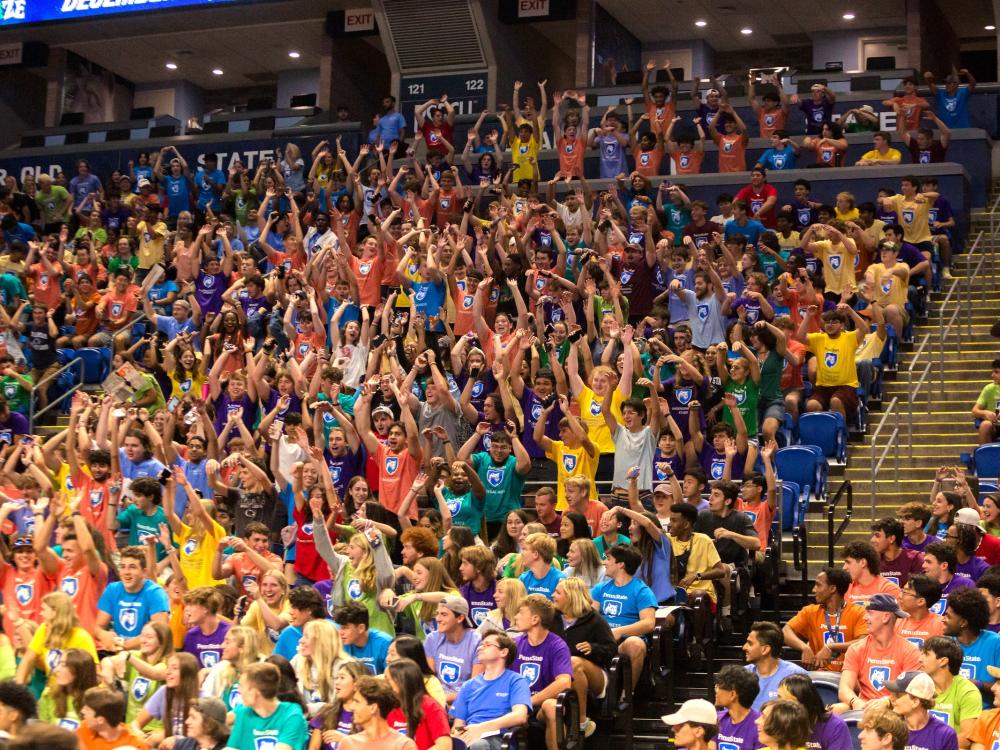 First-year students in the Bryce Jordan Center doing the wave during convocation