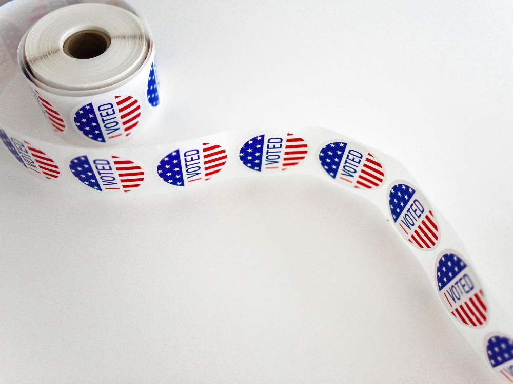 "I Voted" sticker spool on white surface