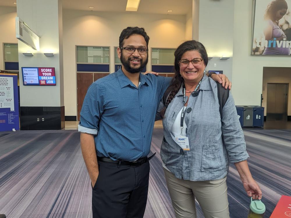  Jamil Gafur, a doctoral student at the University of Iowa, and Gretta Kellogg, ICDS assistant director of strategic initiatives and director of the Center for Applications of Artificial Intelligence/Machine Learning to Industry (AIMI), pose together for a photo at the PEARC conference.