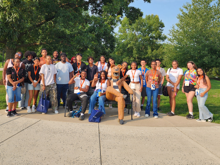 a group of smiling students outside