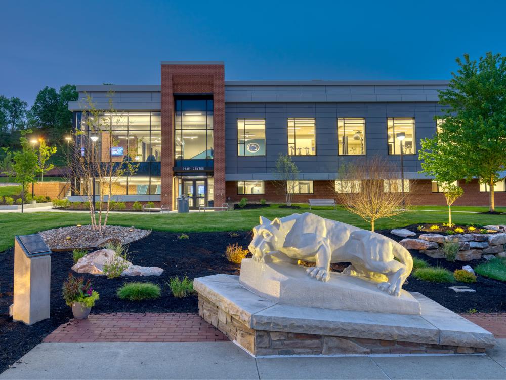 The Lion Shrine, in the foreground, on the Penn State DuBois campus outside the entrance of the PAW Center, which is visible in the background.