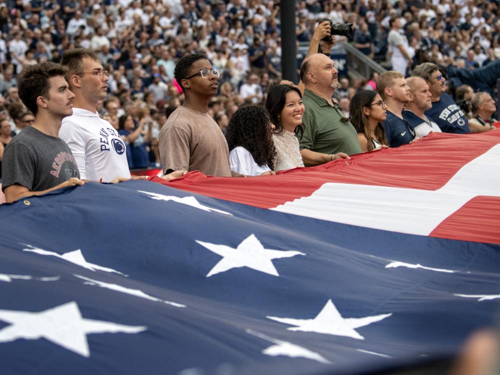 veterans hold flag