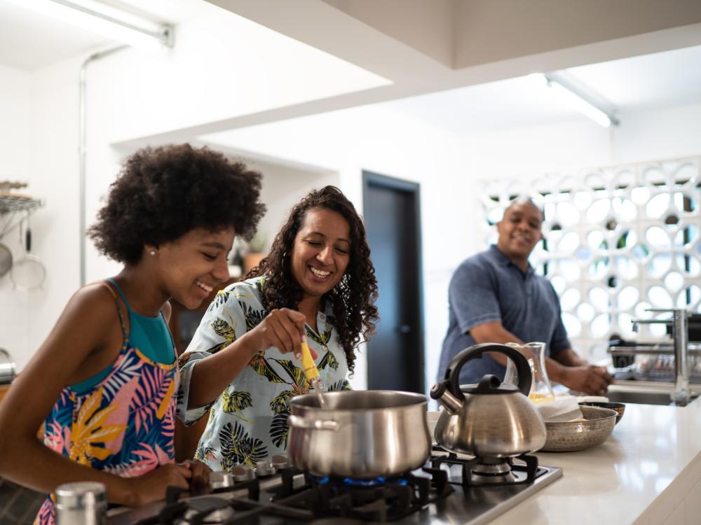 Family cooking together in a large kitchen