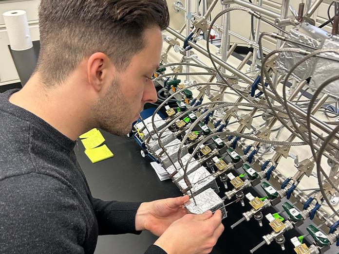 Person working with laboratory equipment