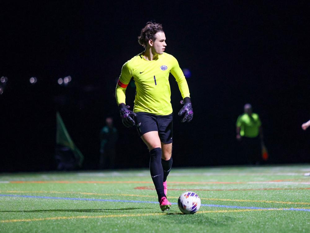 Sasha Mohoruk playing goalie in the middle of a soccer game