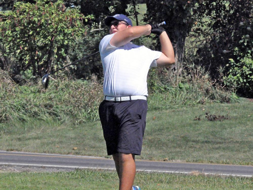 Golfer Nicky Riscica in mid-swing.