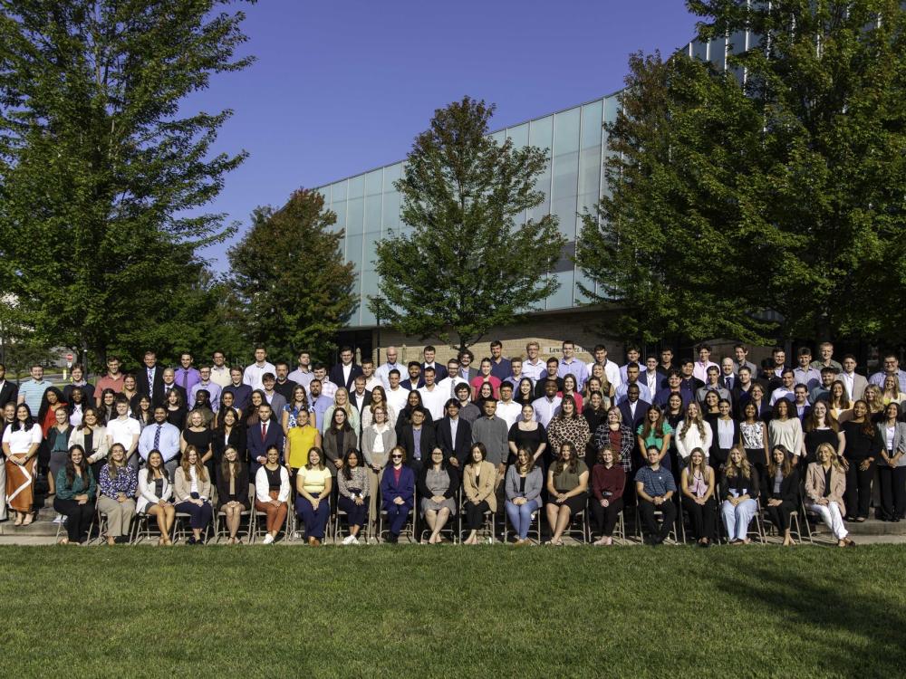 Penn State Law Class of 2027 poses for a group photo outside of the Lewis Katz Building.