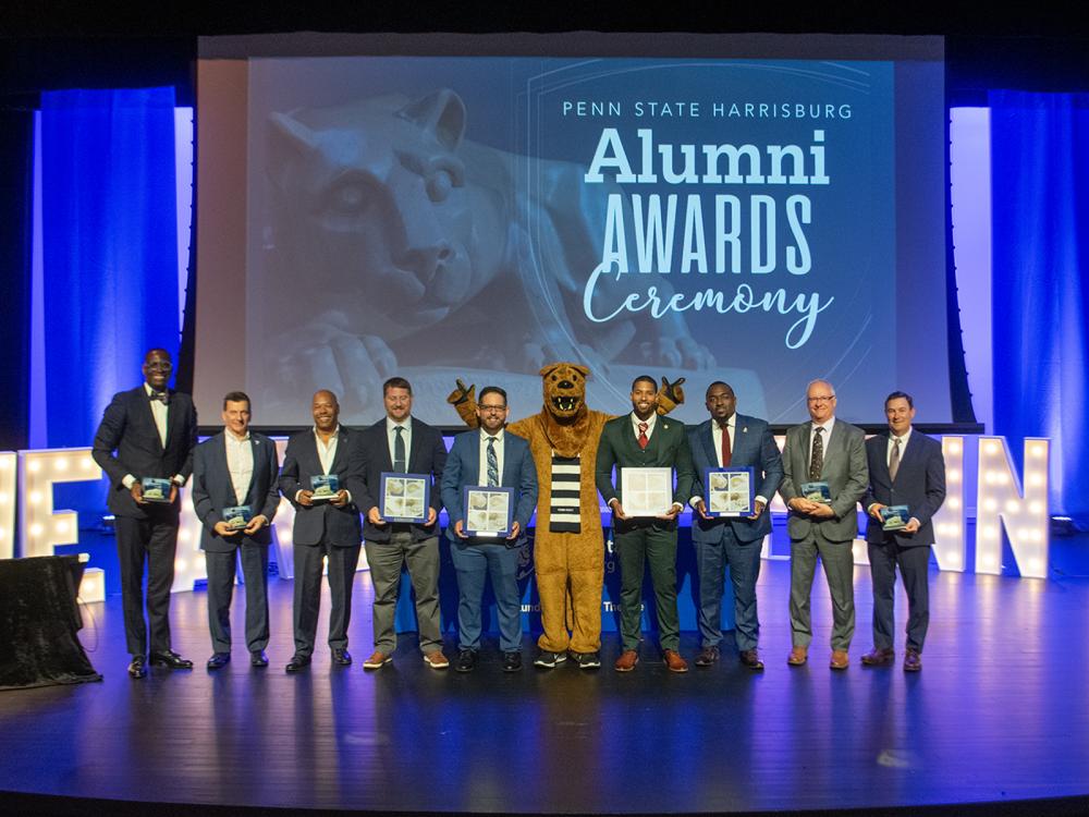 Alumni Award winners gathered onstage in the Kulkarni Theatre