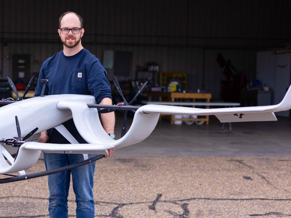 Clark Fuller holds a prototype drone