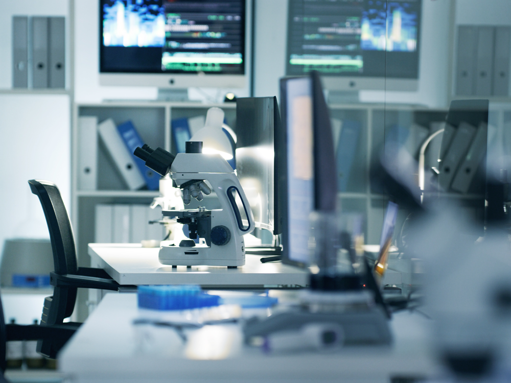 Empty scientific research laboratory with microscope, computer