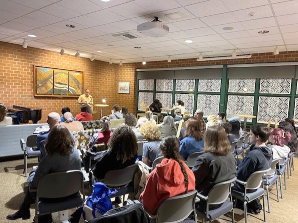 Professor Todd Davis reads from his work at the fall 2024 Hard Freight Café