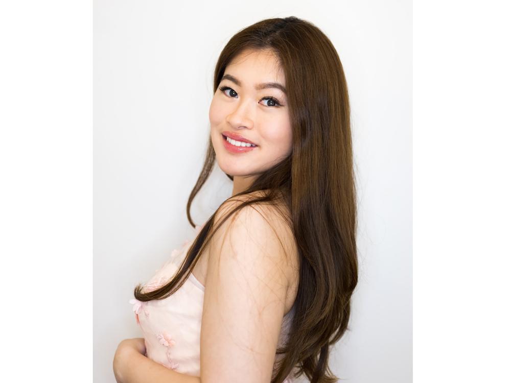 Headshot of young woman with long dark hair