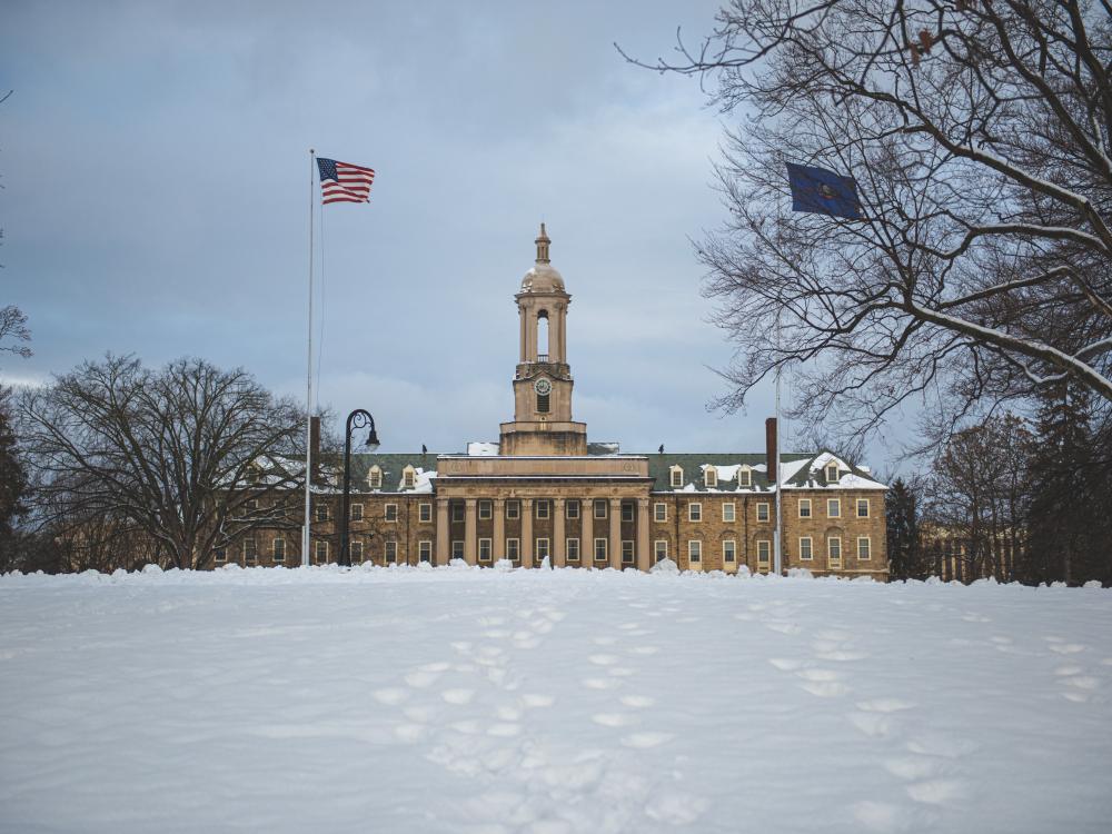 Penn State's Old Main Building with snowy foreground. 