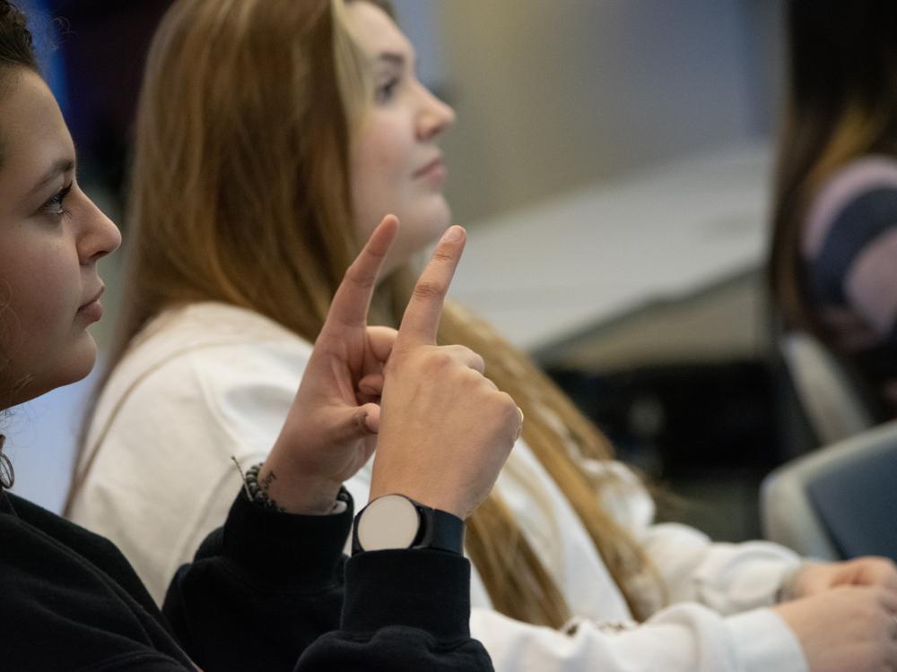 Students practice sign language in class
