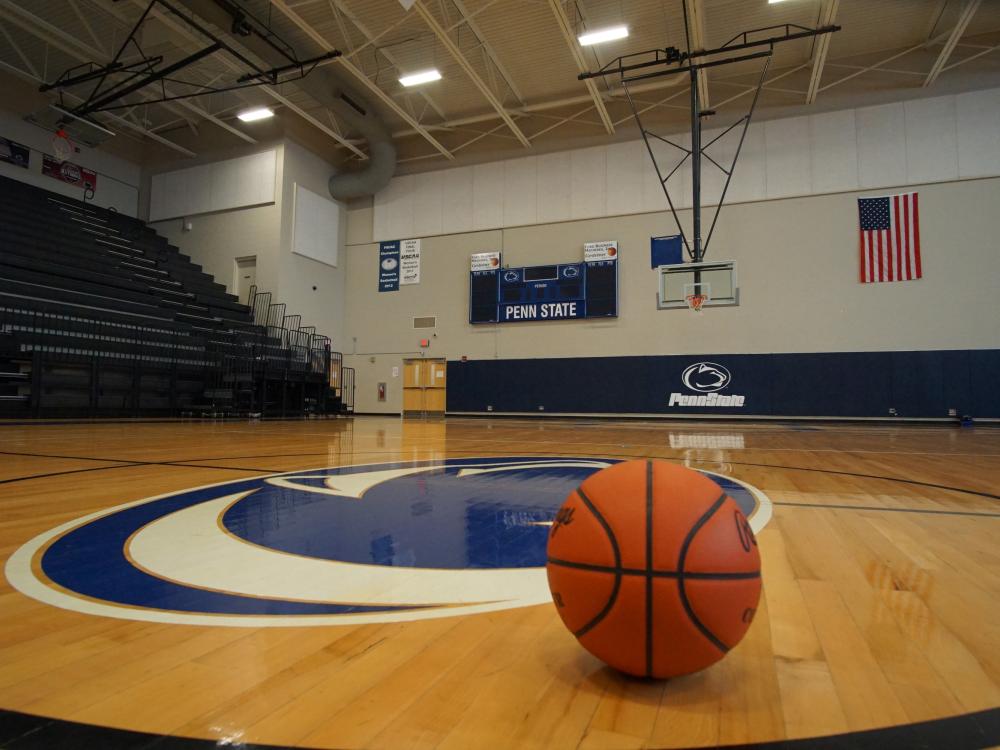 A basketball sits on the empty court inside Penn State Fayette’s Community Center Main Arena. 