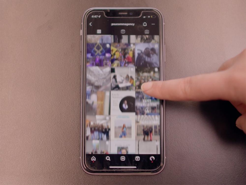 A finger touches a smartphone screen 