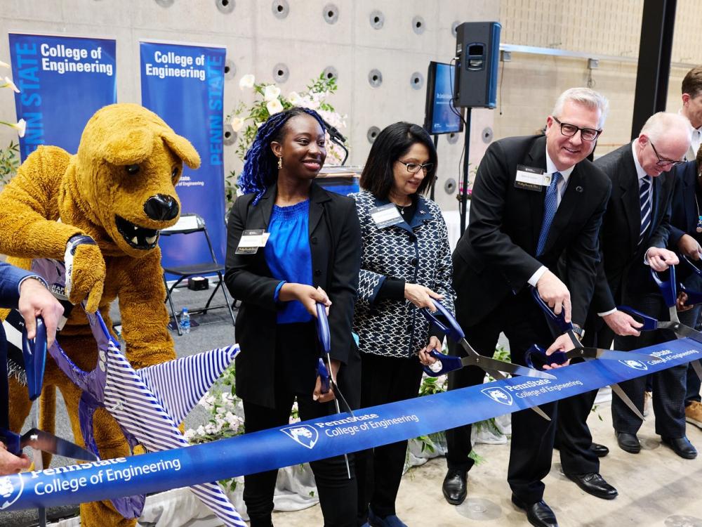 A group of individuals at a ribbon-cutting ceremony